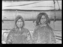Image of Two Inuit in furs, aboard